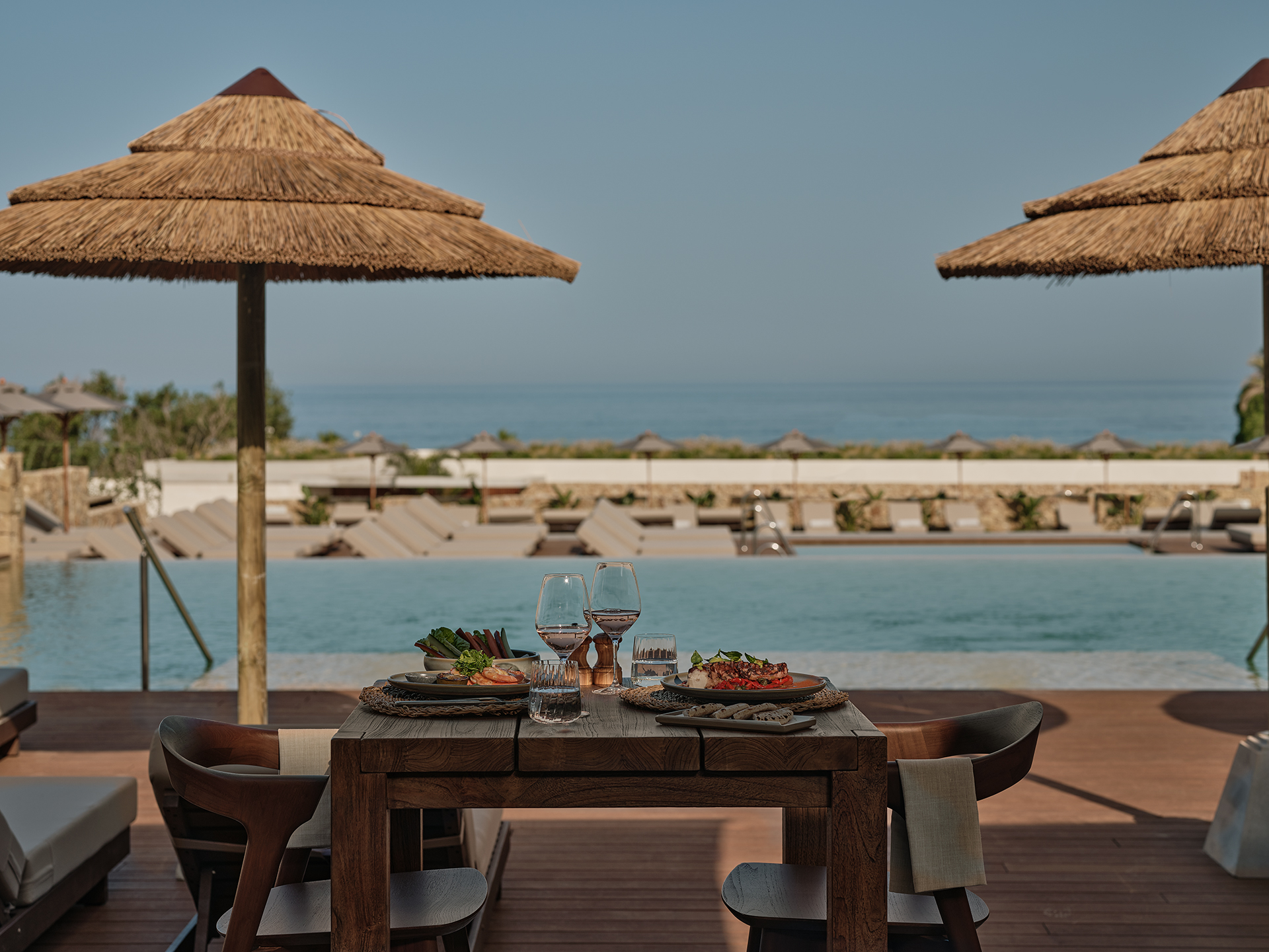 OKU Andalusia luxury five-star hotel swimming pool to kima restaurant
